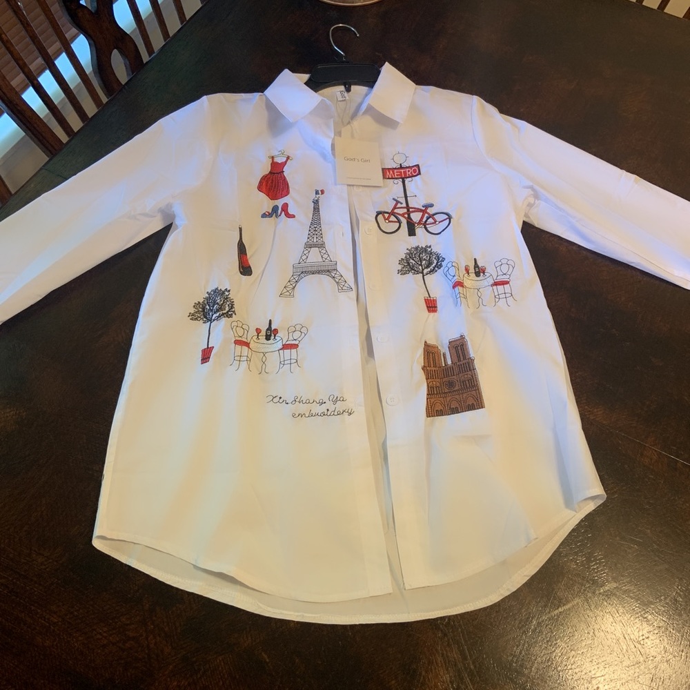 White  blouse with embroidered figures